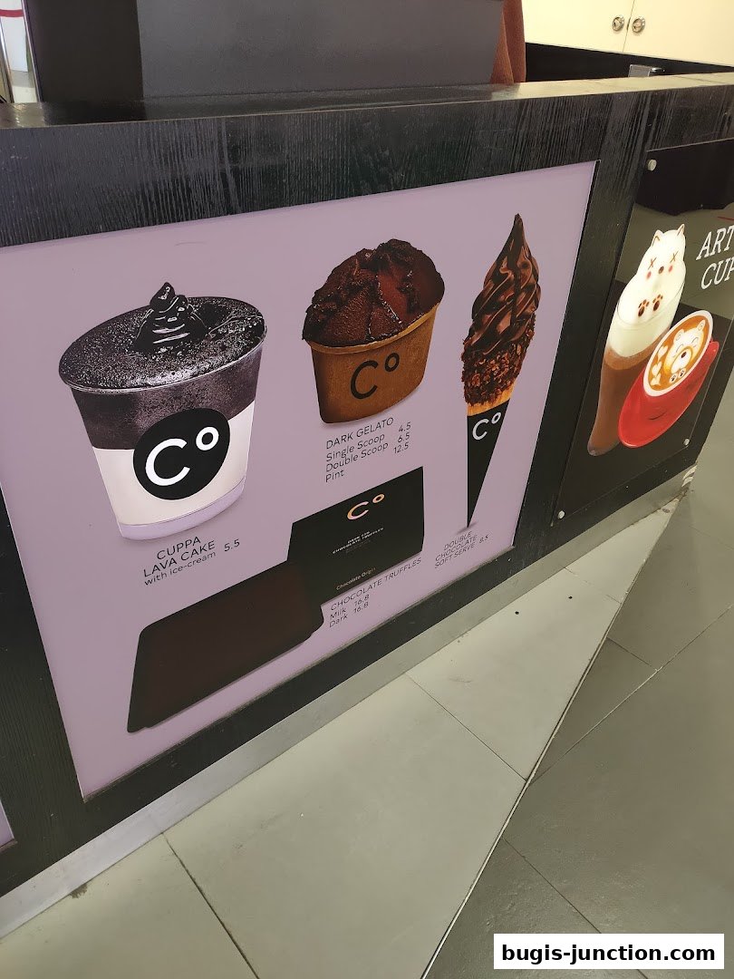 A menu display featuring various chocolate desserts and gelato from Chocolate Origin.