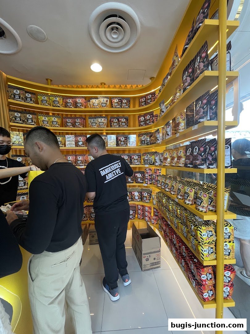 Customers browse shelves stocked with IRVINS snacks in a brightly lit store.