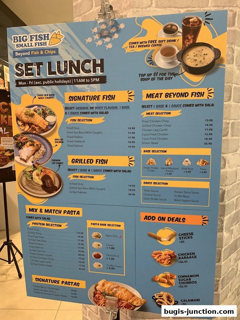 A menu board for Big Fish Small Fish featuring set lunch options, signature fish, grilled fish, pasta, and add-on deals.