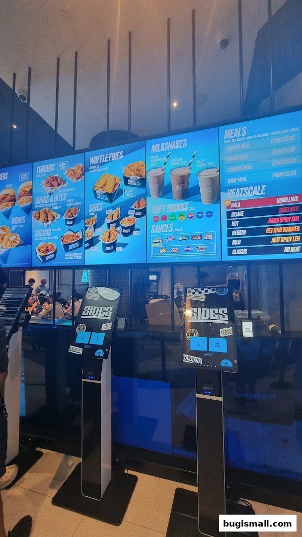 A digital menu board displaying various food items and prices for SIDES restaurant.