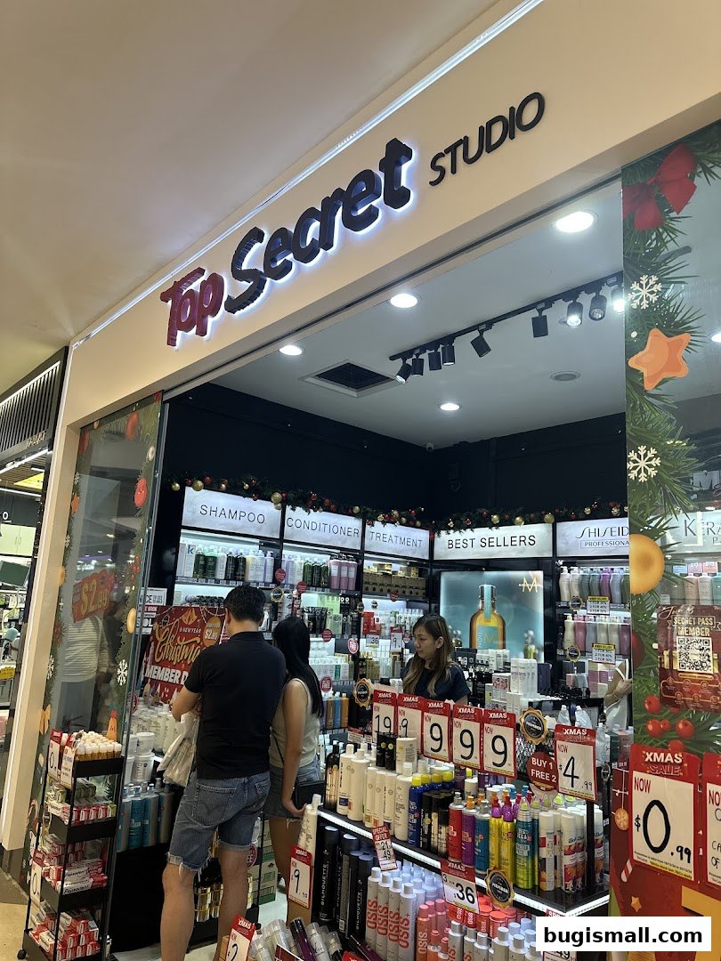 A well-lit beauty store with shelves stocked with hair and skincare products, featuring Christmas decorations.