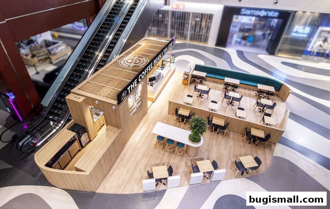 An aerial view of a modern coffee shop with seating areas and a counter.