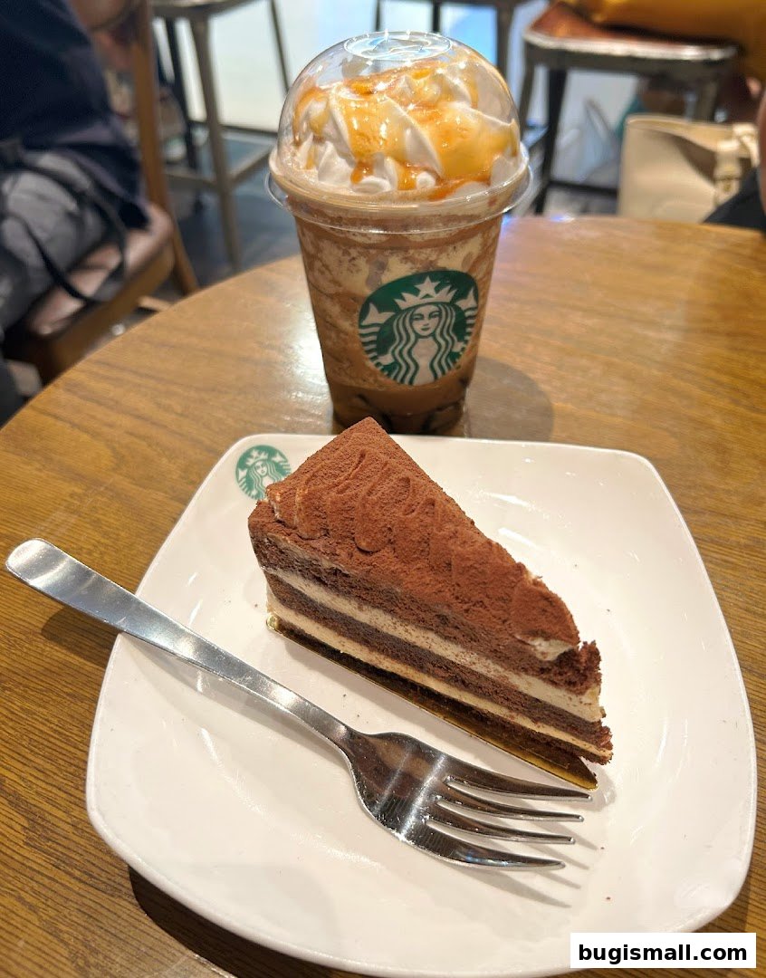 A slice of chocolate cake and a caramel frappuccino from Starbucks.