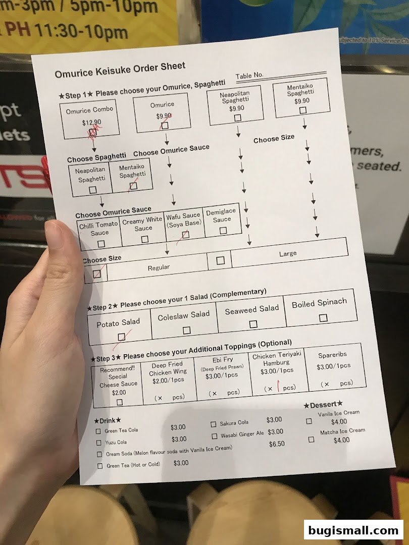A person is holding an order sheet for Omurice Keisuke, with selections marked.