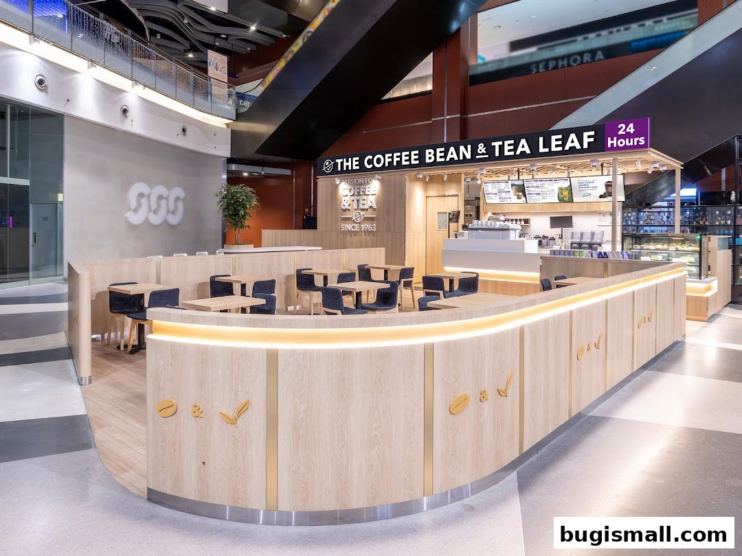 The Coffee Bean & Tea Leaf shop with seating area and a display of pastries.