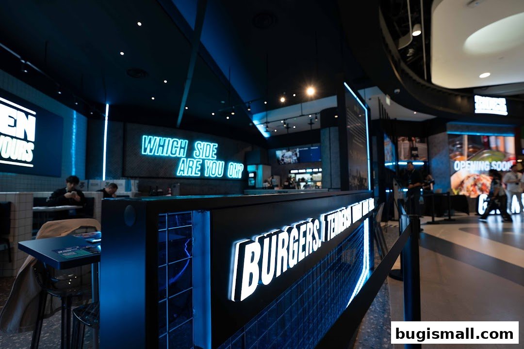 Interior of a modern restaurant with neon signs and seating areas.