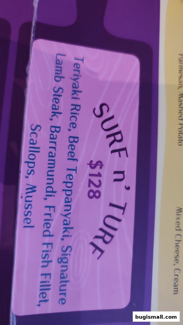 A menu item named 'Surf n' Turf' with a price of $128 and various seafood and meat components.