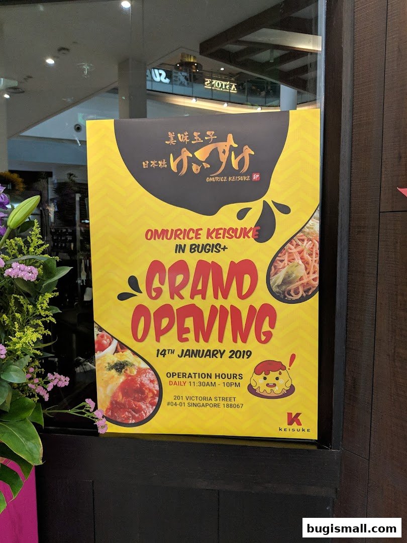 A yellow sign announcing the grand opening of Omurice Keisuke in Bugis+.