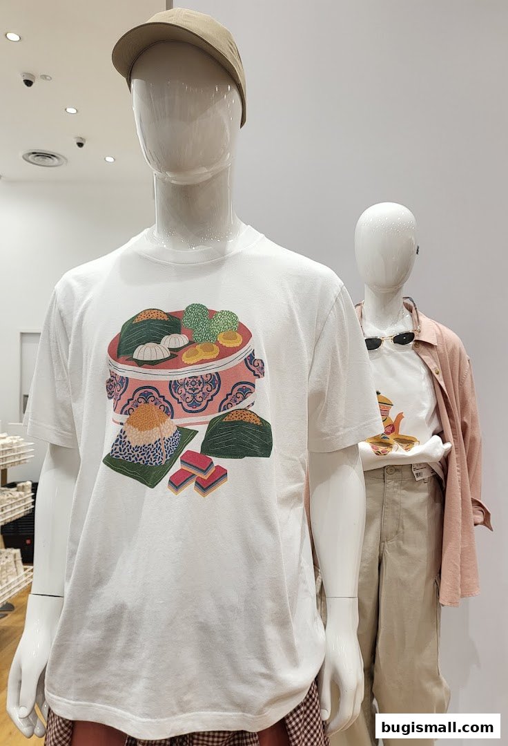Mannequins display white t-shirts with colorful food-themed prints.