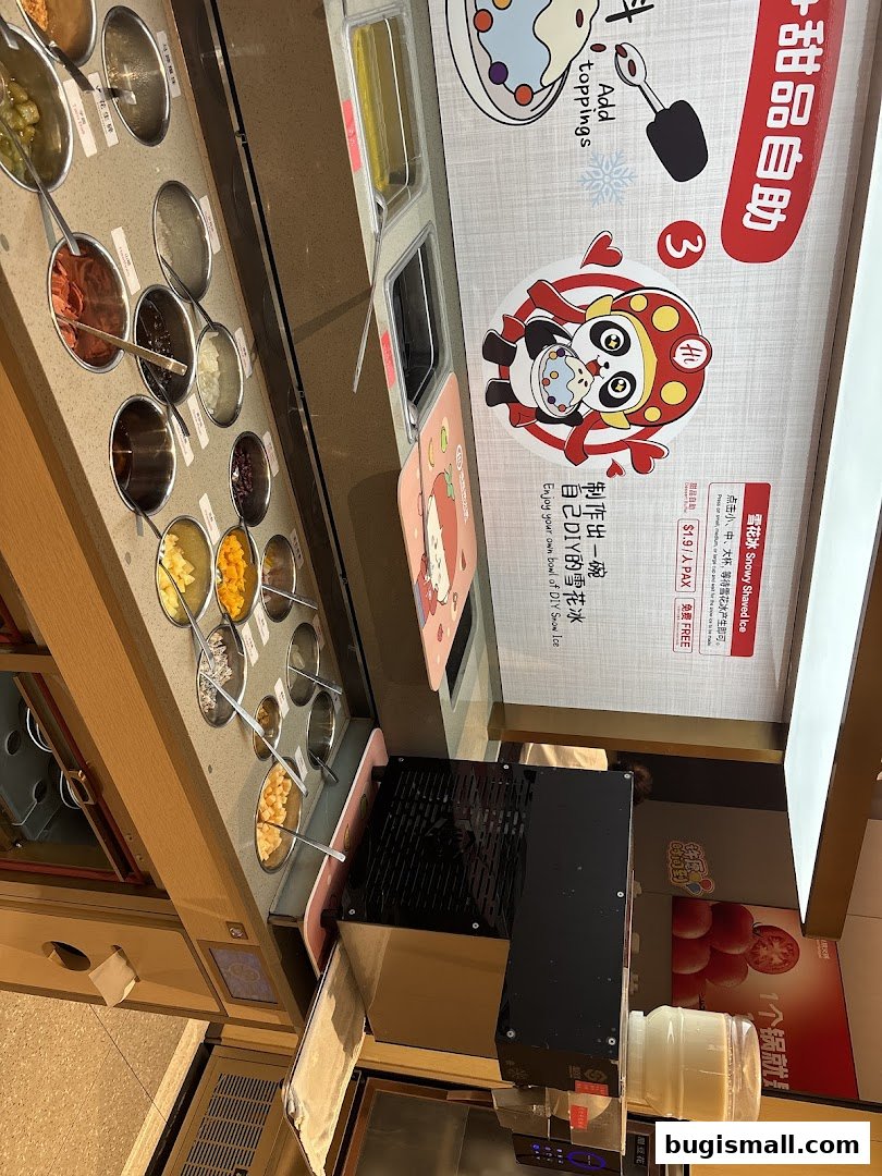A self-serve station with various toppings for desserts, featuring a cartoon panda character.