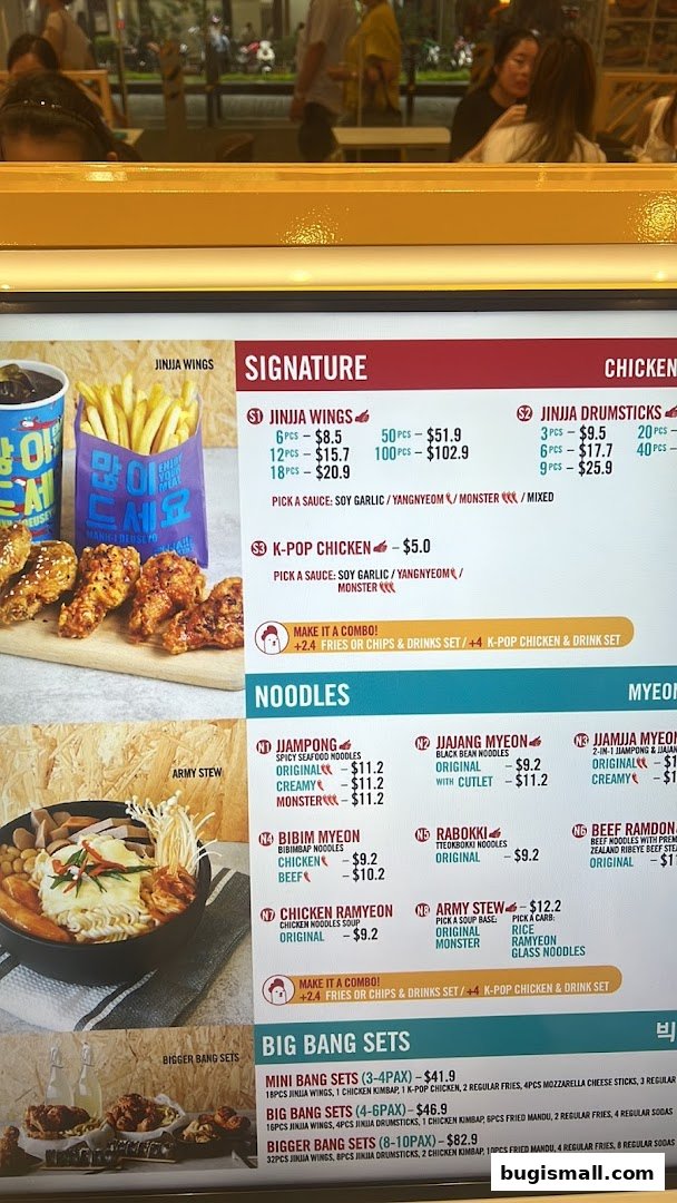 A menu board displaying Korean fried chicken, noodles, and set meals with prices.