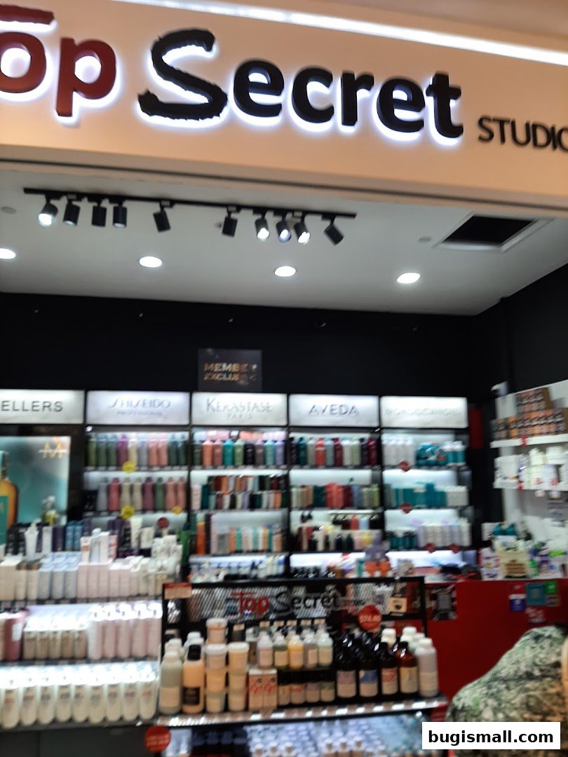 The storefront of Top Secret Studio, a beauty and hair product store.