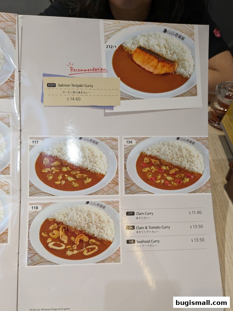 A menu page from CoCo Ichibanya featuring various curry dishes with images and prices.