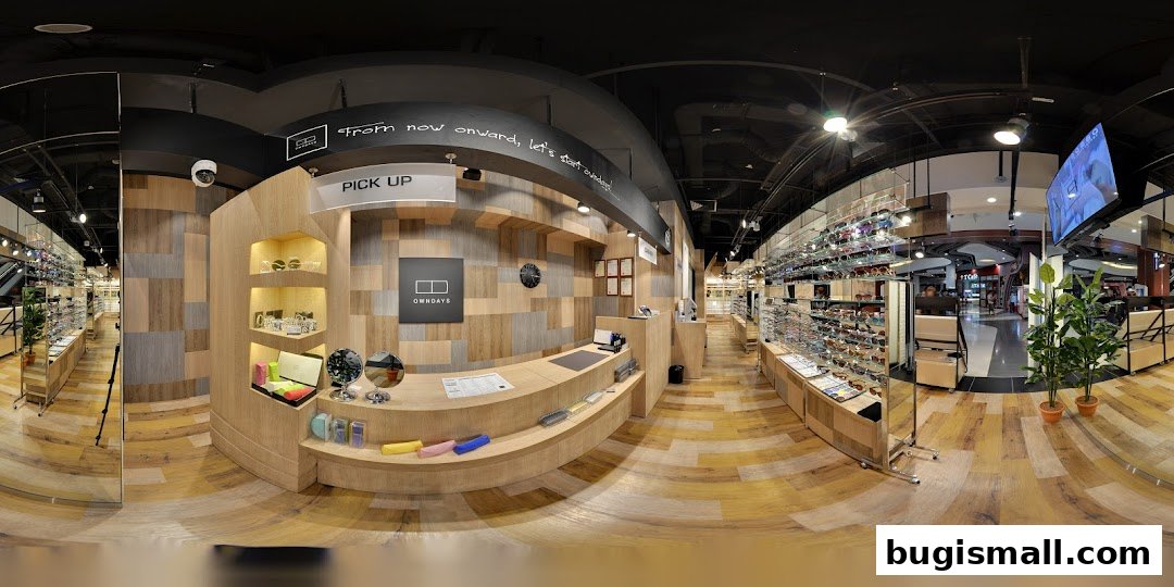 Interior view of OWNDAYS Bugis, showcasing a wide selection of eyewear and a modern, wooden-themed interior.