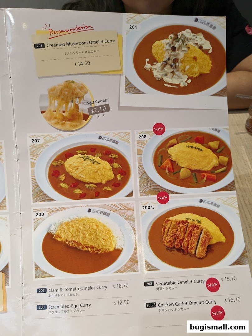 A menu from CoCo Ichibanya featuring various omelet curry dishes with prices.