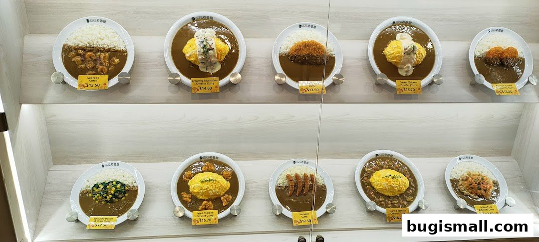 Display of various Japanese curry dishes with rice and toppings.