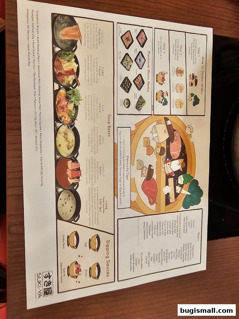 A menu from Suki-Ya showcasing shabu-shabu soup bases, premium items, and dipping sauces.