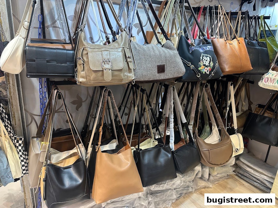 A diverse collection of stylish handbags displayed on racks, showcasing various designs and colors.