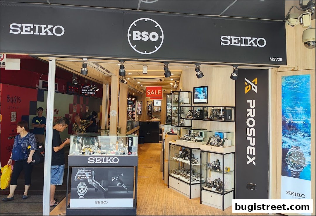 The entrance of a Seiko watch shop, showcasing various watches and a "SALE" sign.