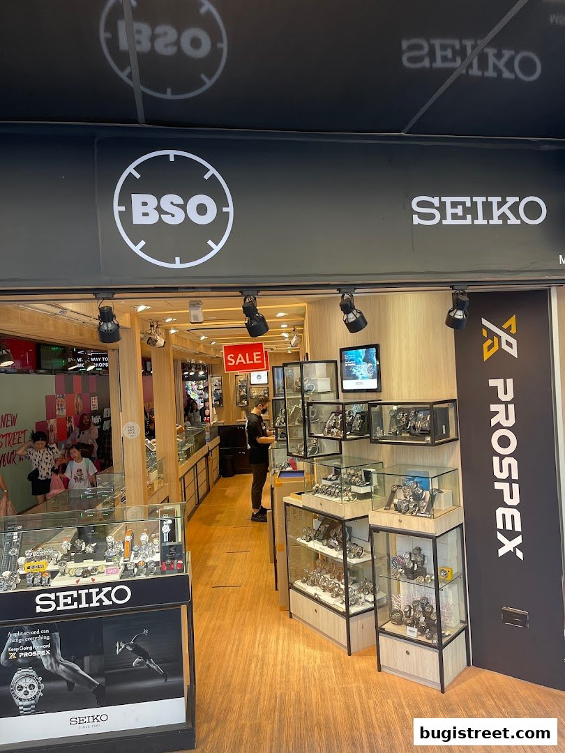 The BSO Watch shop front displays a variety of Seiko watches in illuminated display cases.