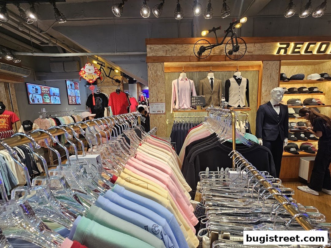 A clothing store interior with racks of colorful apparel and mannequins displaying outfits.