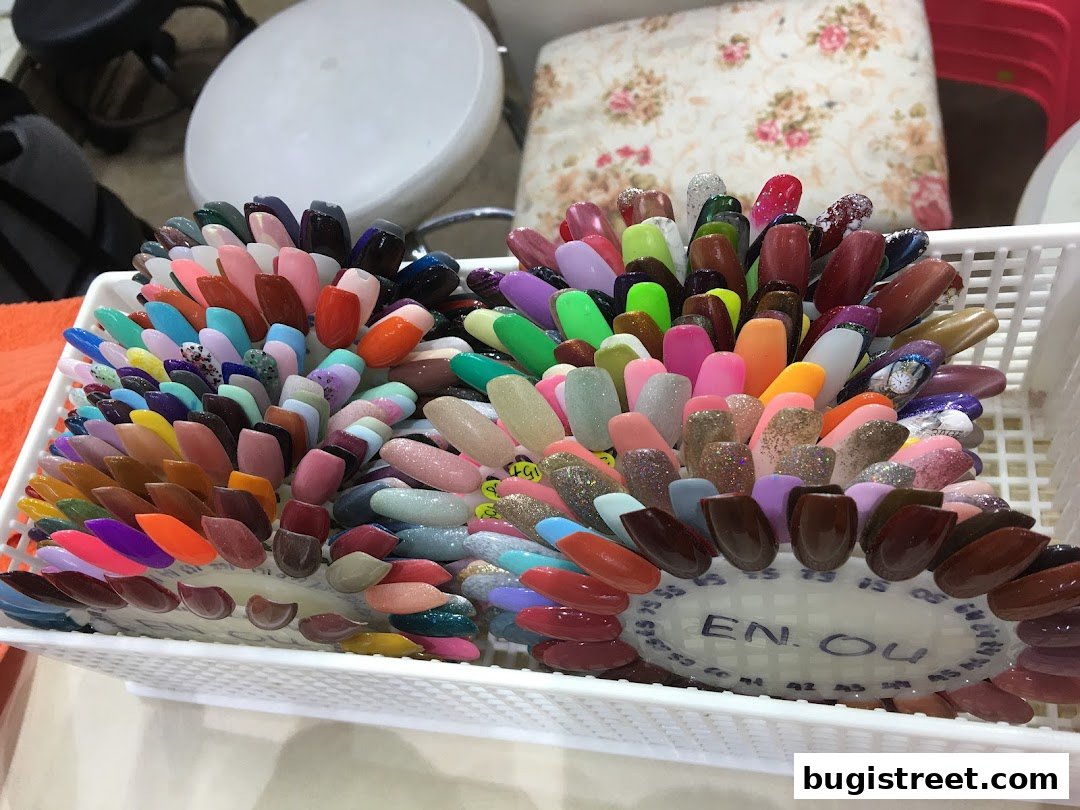 A display of numerous nail polish color swatches arranged in a white basket.