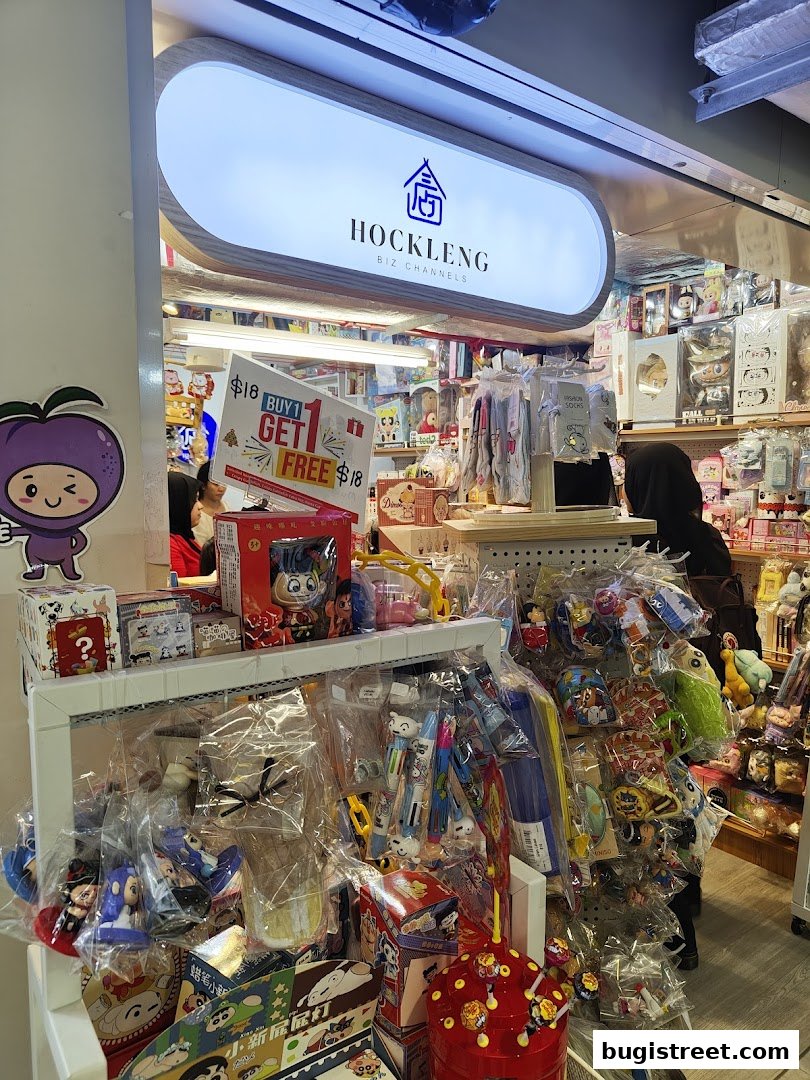 A shop called Hockleng Biz Channels displaying various toys and merchandise, with a 'Buy 1 Get 1 Free' promotion.