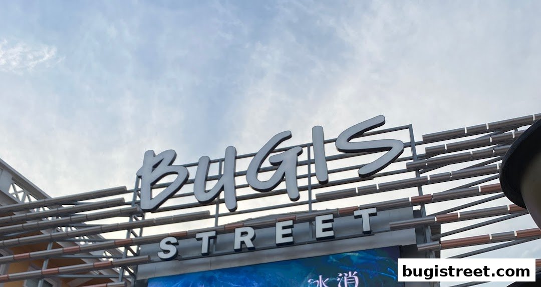 A sign for Bugis Street against a cloudy sky.