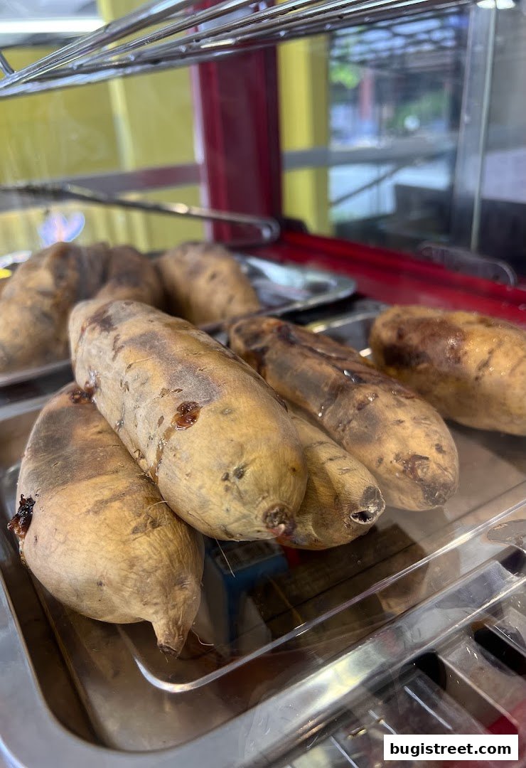 Close-up of roasted sweet potatoes in a display case at Chanko Oden.