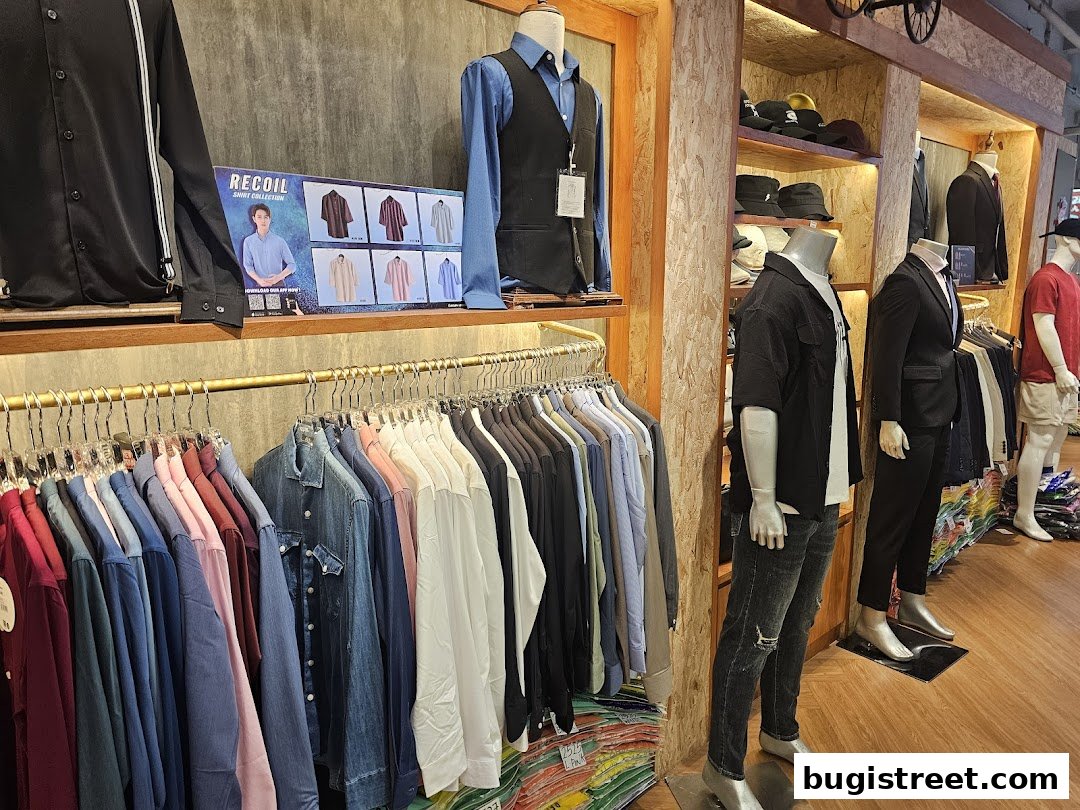 A well-lit retail shop displaying a wide variety of men's shirts and suits on mannequins and racks.