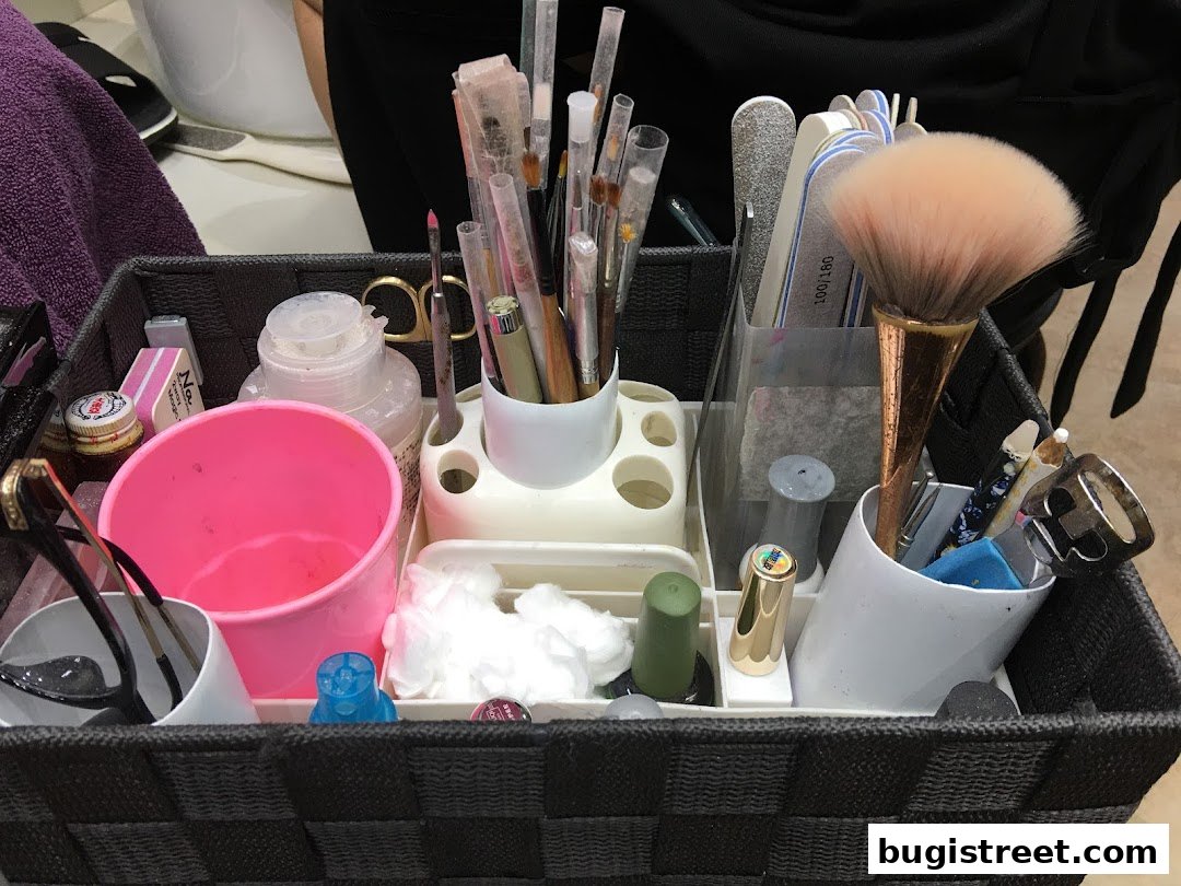 A basket filled with nail care tools, brushes, and polishes.