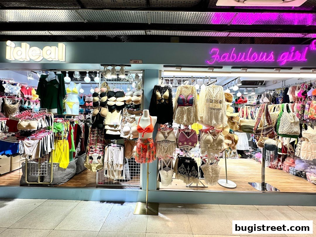 A brightly lit shop displaying a wide variety of lingerie, swimwear, and accessories.