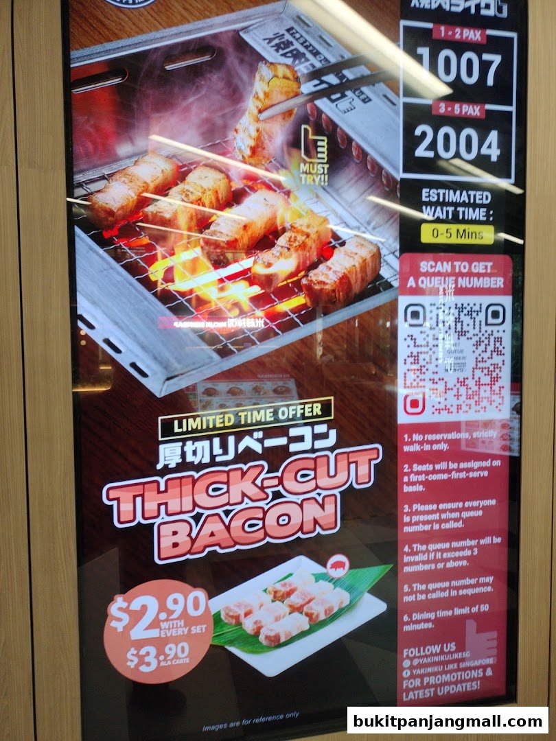 A digital display advertising thick-cut bacon at Yakiniku Like, showing queue information and a special offer.