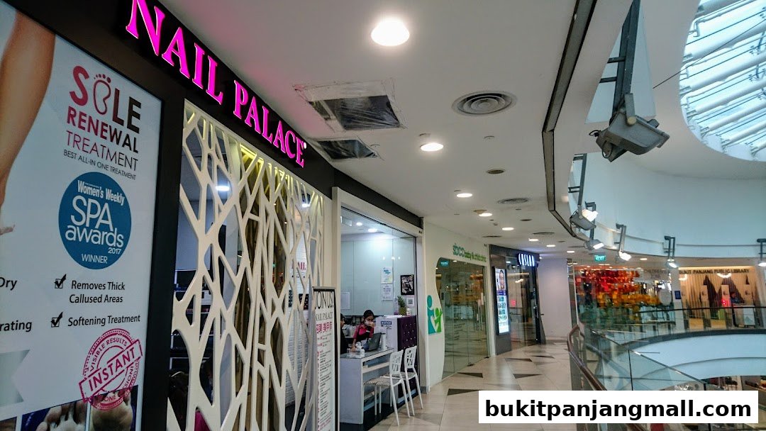 The exterior of Nail Palace, a nail salon, with a promotional poster for a sole renewal treatment.
