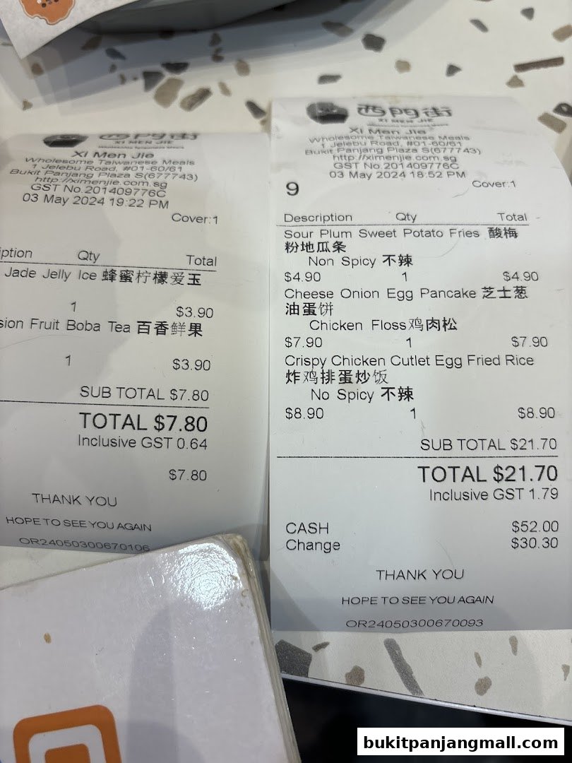 Two receipts from Xi Men Jie, a Taiwanese meals shop, detailing food orders and payment.