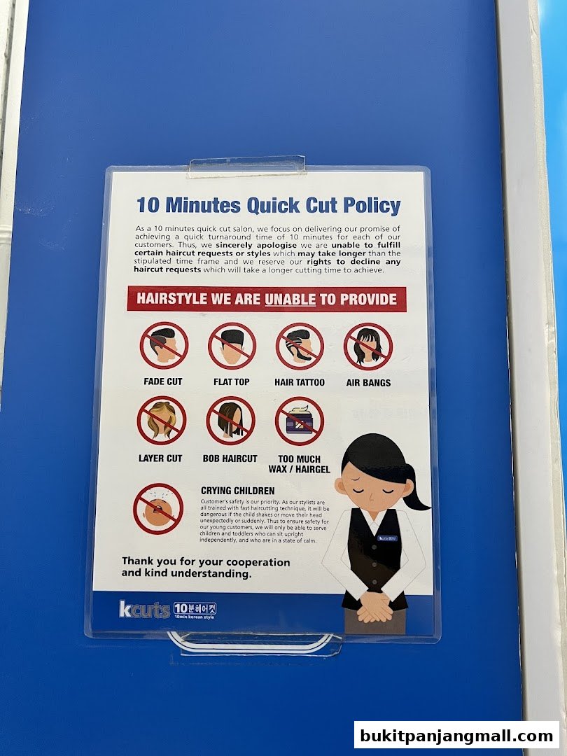 A sign detailing the 10 Minutes Quick Cut Policy and hairstyles not provided.