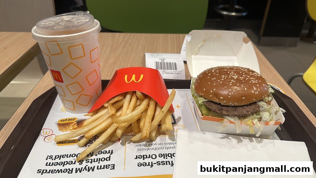 A tray of McDonald's food including a Big Mac, fries, and a drink.