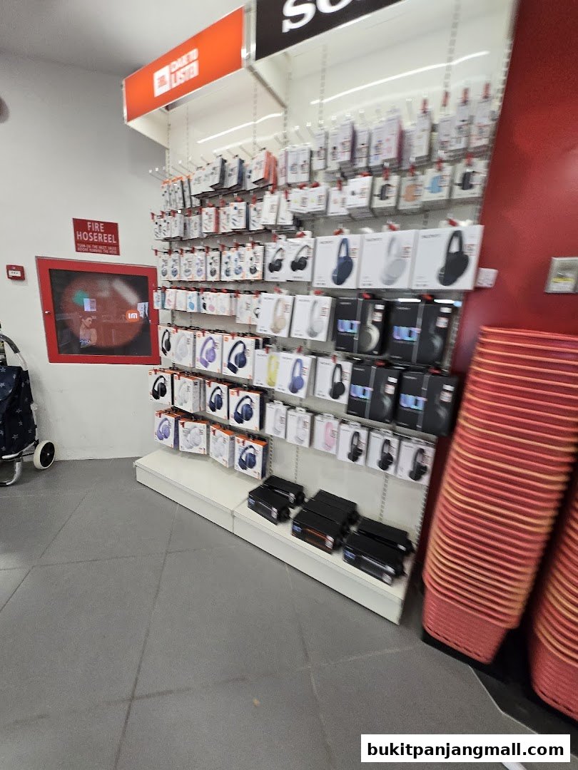A retail store display featuring a wide selection of headphones and audio accessories.