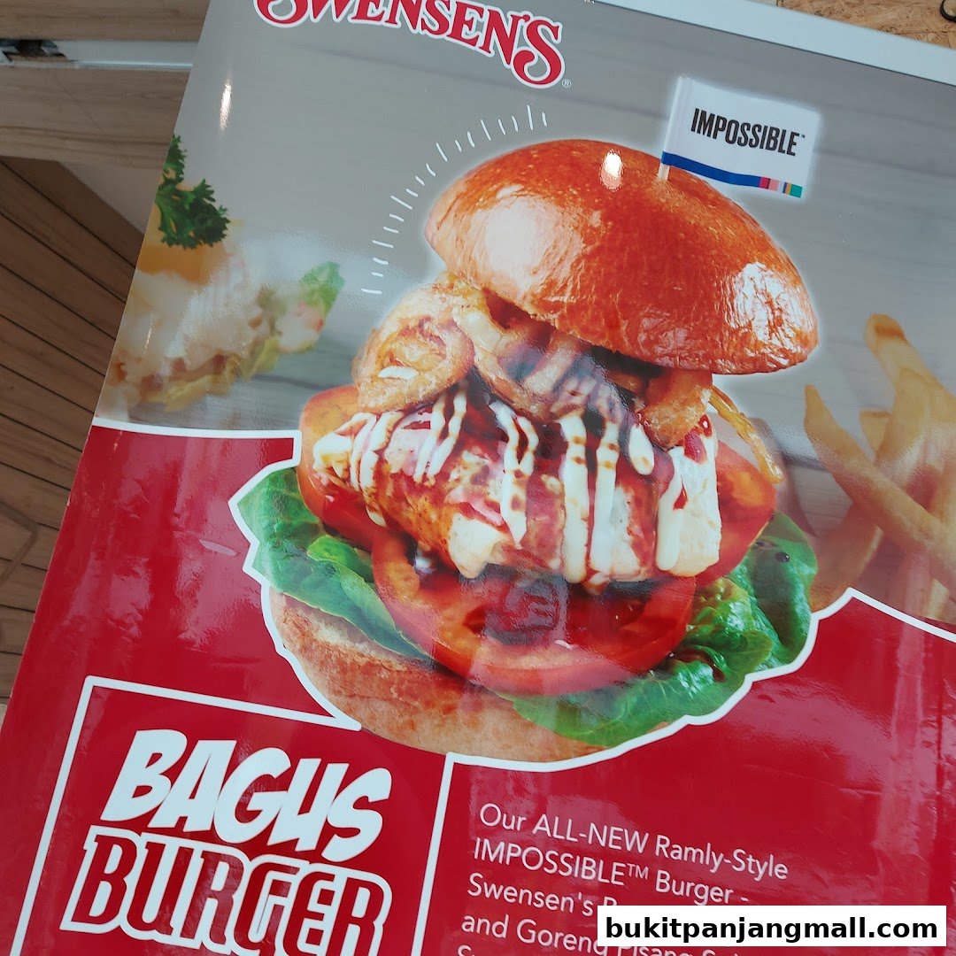 A close-up of Swensen's Bagus Burger, featuring an Impossible patty and fries.