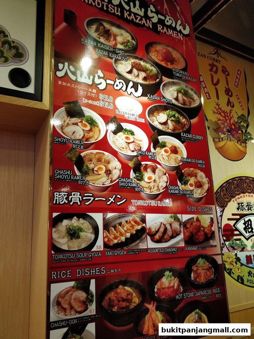 A menu board for Tonkotsu Kazan Ramen featuring various ramen dishes, side dishes, and rice bowls.