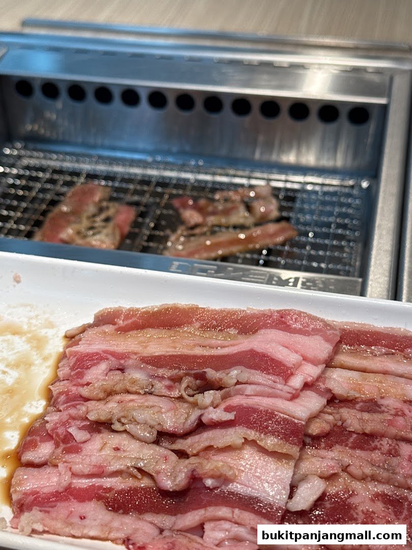 Slices of raw beef ready for grilling at Yakiniku Like.