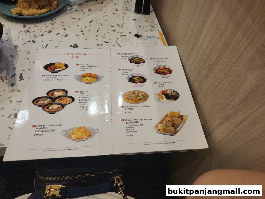 A menu from Xi Men Jie featuring Taiwanese dishes like braised pork rice and fried rice.