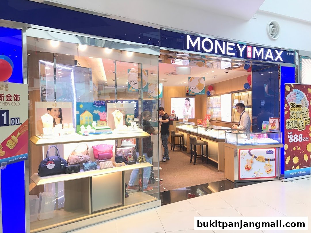 MoneyMax Pawnshop showcases jewelry and bags in its well-lit store with staff attending to customers.