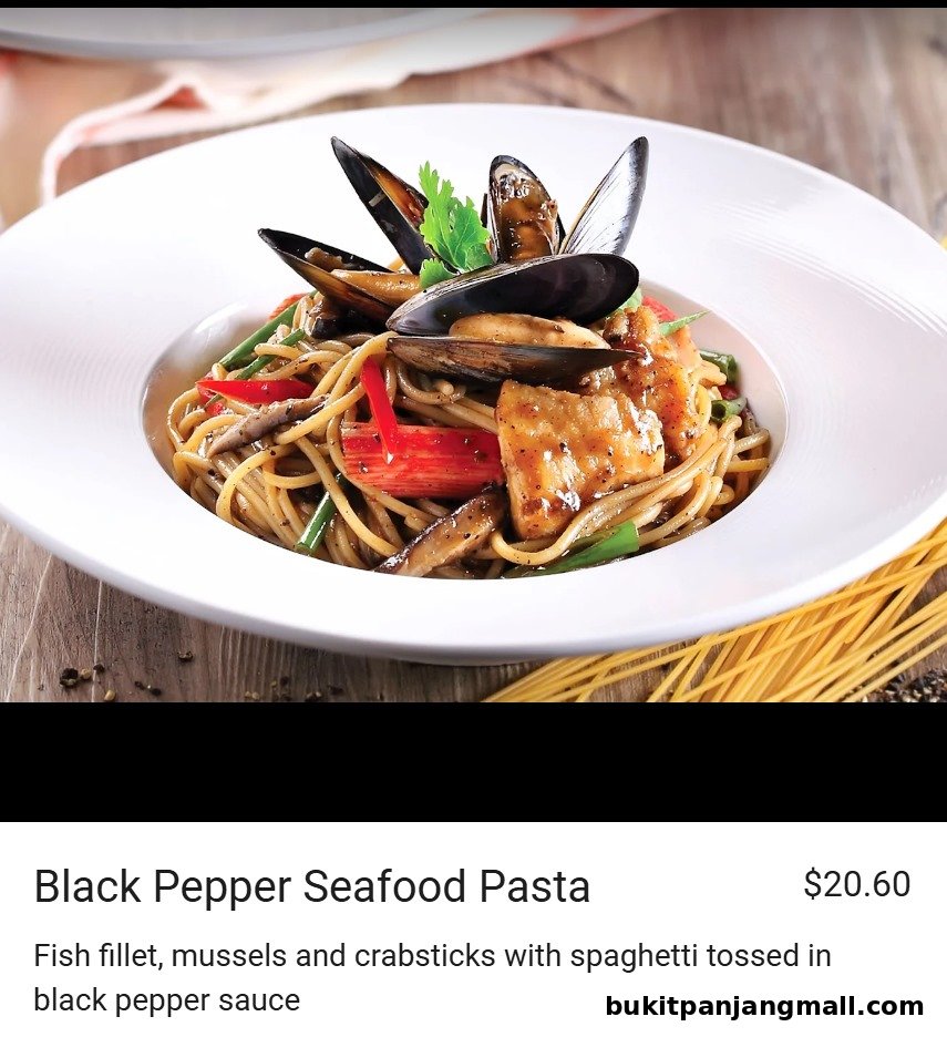 A close-up of Black Pepper Seafood Pasta with mussels, fish, and crabsticks.