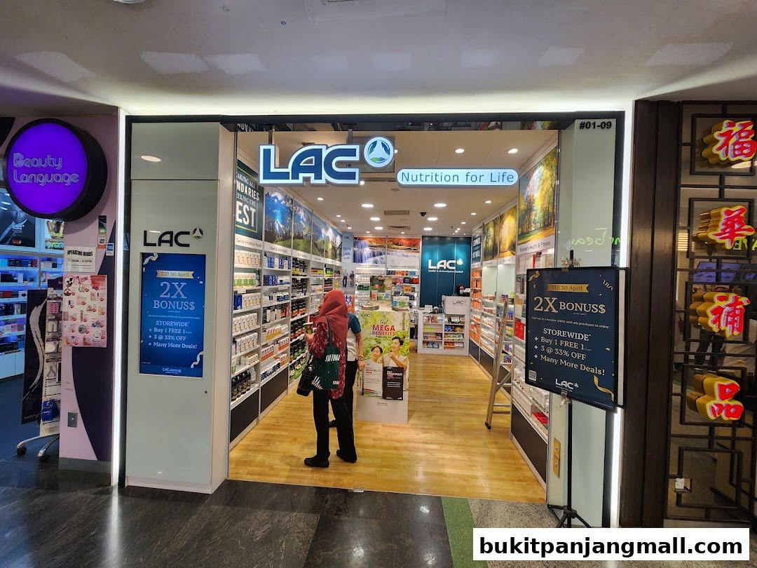 The entrance of LAC Nutrition For Life store, showcasing health supplements and promotional offers.