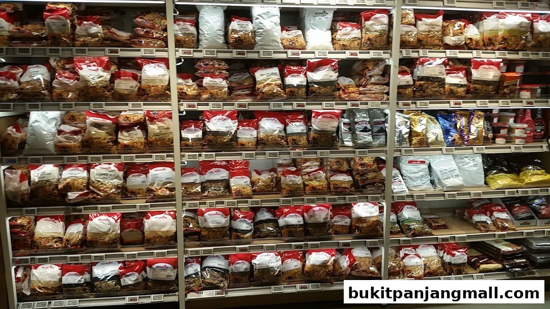 Shelves stocked with various bagged nuts, dried fruits, and baking ingredients.