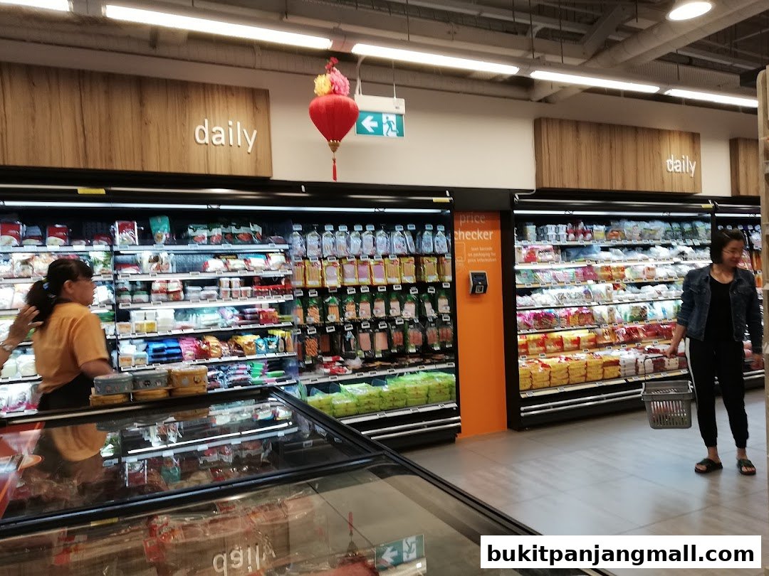 A FairPrice Finest supermarket aisle with refrigerated shelves stocked with various food products.