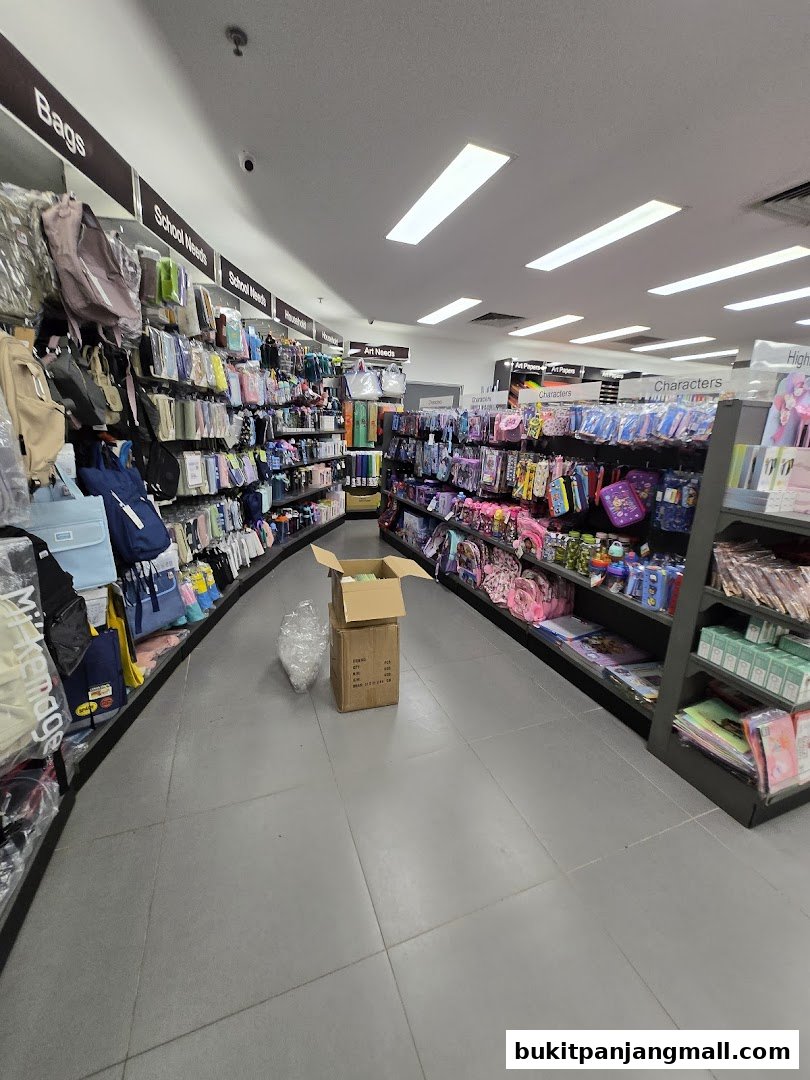 Interior view of a POPULAR Bookstore, showcasing aisles of bags, school supplies, and art materials.