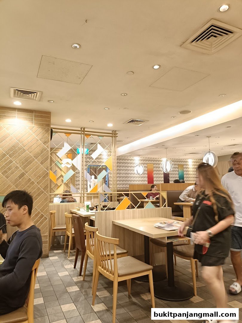 Interior view of Ichiban Sushi with diners seated at tables and modern decor.