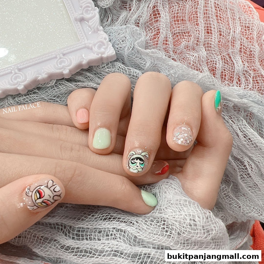 Close-up of hands with creative nail art featuring cartoon characters and pastel colors.